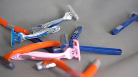 Person throws out used plastic disposable razors Stock Footage 116494000