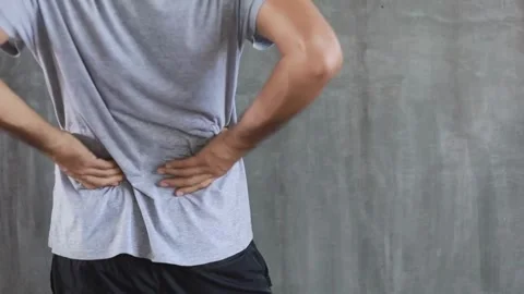 Person touching and messaging back with painful ache injury backache medical Stock-Footage 336585170