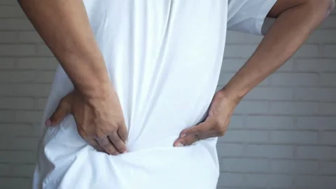 Person touching and messaging back with painful ache injury backache medical Stock-Footage 336585268