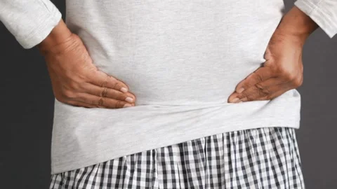 Person touching and messaging back with painful ache injury backache medical 스톡 동영상 336585272
