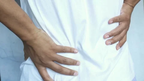 Person touching and messaging back with painful ache injury backache medical Video stock 336585282