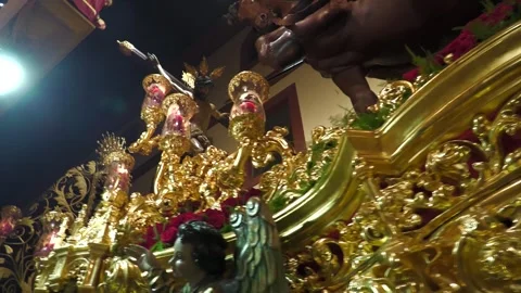 Person Touching Cross From Balcony During Semana Santa in Seville Stock Footage 336007716