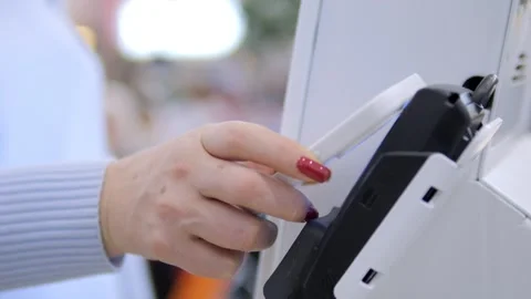A person is touching a machine with a card reader Stock Footage 297732893
