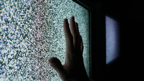 Person Touching Old Analog Tv Screen Displaying Static Interference Stock Footage 335633761