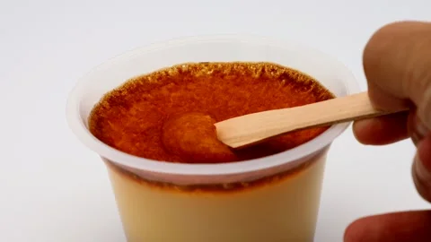 A person trying to eat baked pudding Stock Footage 335591985