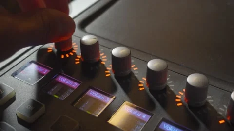 A Person Turning a Few Knobs on a Music Mixer 動画素材 163701338