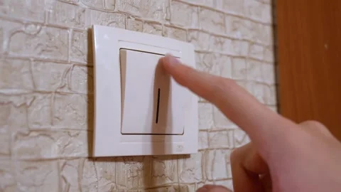 Person turning light switch on and off Stock Footage 330081609