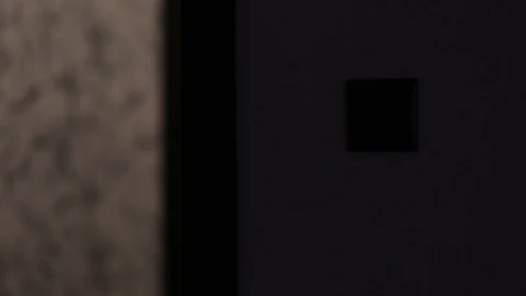A person turns on the light when entering the room Stock Footage 112874750