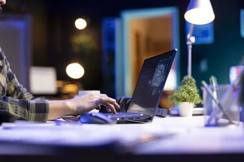 Person types and computes code on laptop Stock Photos