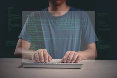 Person typing code on a keyboard with a digital overlay, representing progr.. Stockfoto's