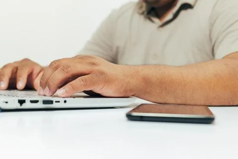 Person typing on computer at desk Stock Photos