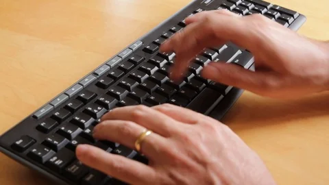 Person typing on a computer keyboard Stock Footage 92781625