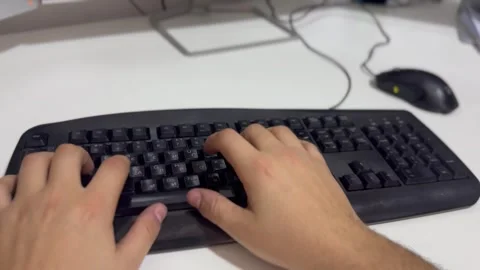 Person Typing on a Computer Keyboard Video stock 297730802
