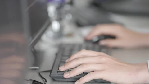 A person is typing on a computer keyboard Stock Footage 301626506