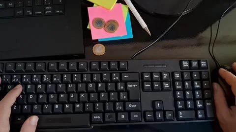 Person typing on a computer keyboard. Office worker using PC for digital Stock Footage 340241502