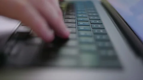 Person typing fast on a laptop computer keyboard 스톡 동영상 235349161