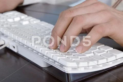 Person typing on keyboard, close-up Stock Photos