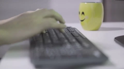 Person typing on a keyboard Stock Footage 144545325