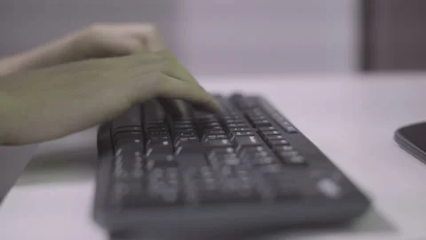 Person typing on a keyboard Stock Footage 144545414