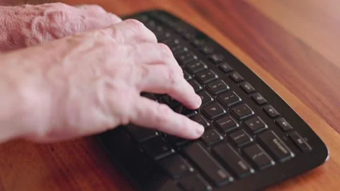 Person typing on a keyboard Stock Footage 246657479