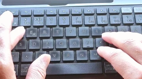 Person typing on keyboard for laptop Stock Footage 275887458