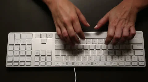 Person typing on keyboard, overhead view Stock Footage 26315531