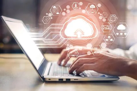 Person typing on a laptop with a 3D rendering of cloud computing technology and Stock Illustration