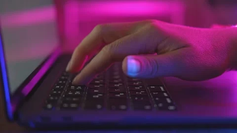 Person typing at laptop computer at night. Stock Footage 242591383