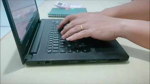 Person typing on a laptop Stock Footage 272734631