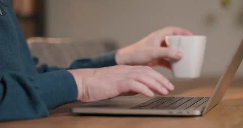A person typing on a laptop Stock Footage 303707963
