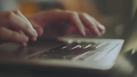 Person typing on a laptop keyboard for digital work and communication. Stock Footage 337613596