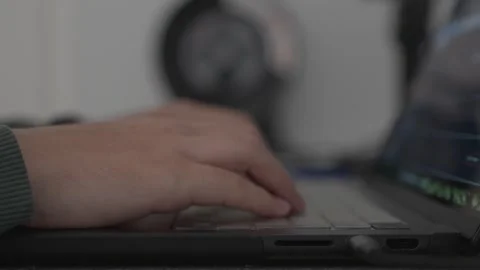Person typing on laptop keyboard during focused work session Stock Footage 331049261