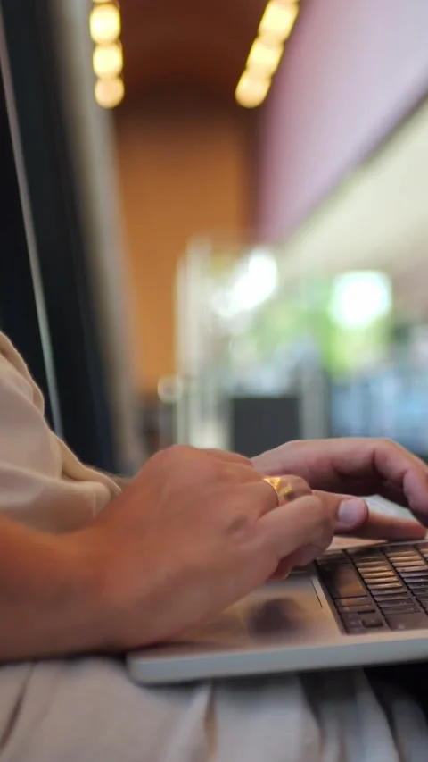 Person Typing on Laptop in Library, Close-Up of Modern Workspace... Stock Footage 344455133