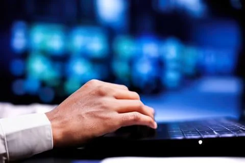 Person typing on laptop with tech background Stock Photos