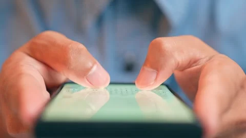 A person is typing a message to AI on their smartphone. Stock Footage 316567887