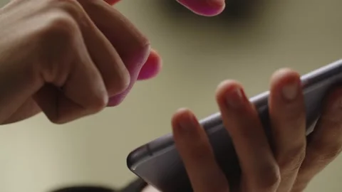 Person is typing a message on smartphone. Cropped view of a man holding phone Stock Footage 236643618