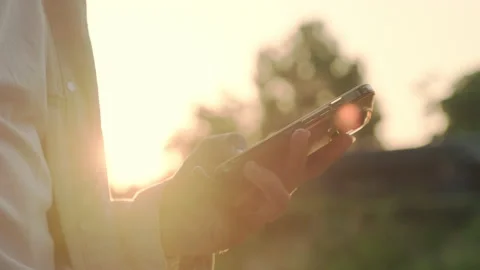 Person is typing a text message on a cell phone phone - close-up.  Hands usin Stock Footage 201610718
