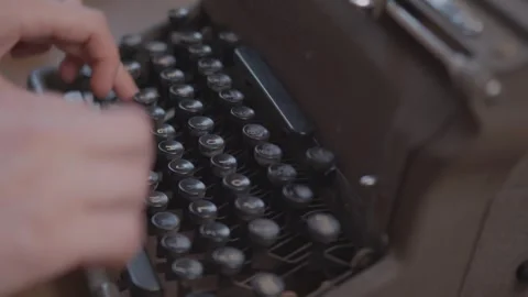Person Typing on a typewriter 4K Stock Footage 243396749