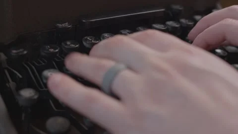 Person typing on a typewriter closeup 4K Stock Footage 243396917