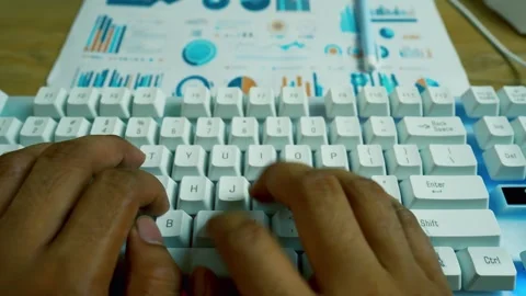 Person typing on a white keyboard in front of a computer monitor, with a bl.. Vídeo Stock 315981112