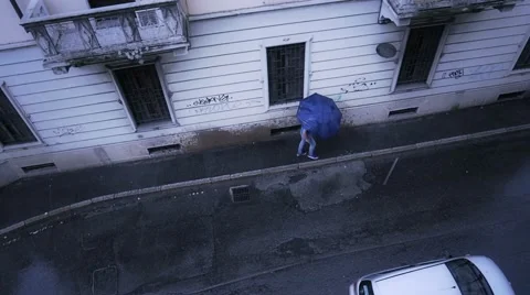 Person with umbrella gets splashed by car in city 스톡 동영상 49925411
