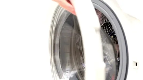 Person unloading and loading clean cloth after doing cleaning laundry in machine Stock Footage 336594437