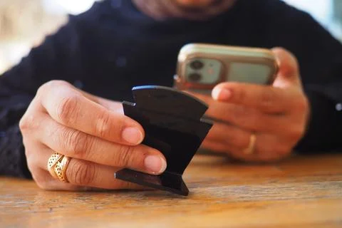Person uses a phone while scan the QR code for the cafe menu 库存照片