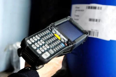 Person using a bar scanner Stock Photos