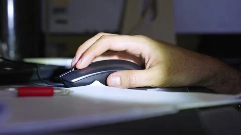 Person using black computer mouse at night Stock Footage 334408922