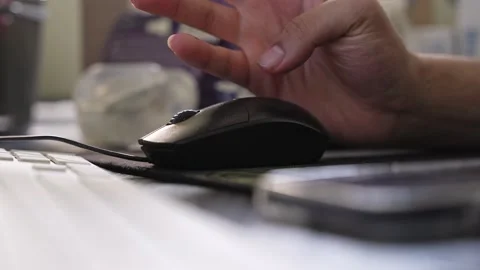 Person using black computer mouse in office Stock Footage 334409073