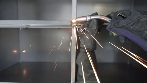 Person using a blowtorch on a factory 動画素材 75167326