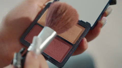 Person Using Blush With Soft Brush In Mirror, Vibrant Influencer Tutorial Stock Footage 327022482