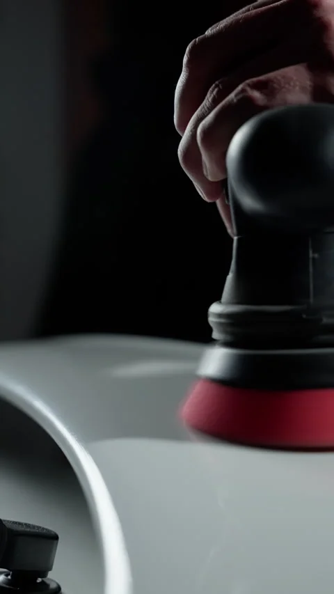A person is using a buffing tool on a surface Stock Footage 269982227