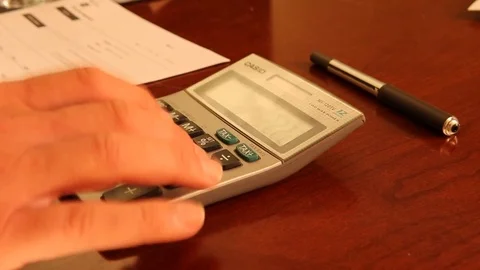 Person using a calculator Stock Footage 92781605